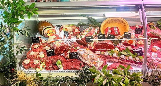 The butcher shop window display decorated for the Butchery Specialty Contest